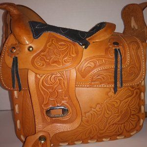 Tooled leather western style saddle handbag